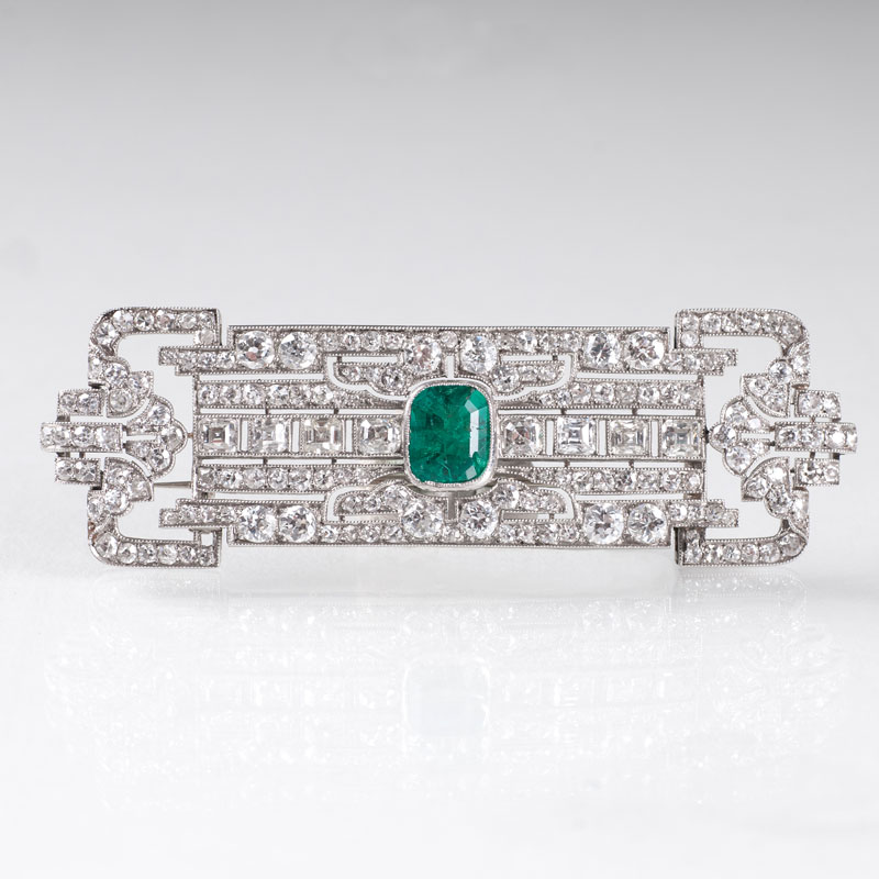 A very fine Art Déco diamond emerald brooch