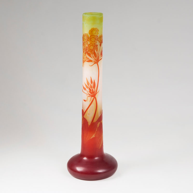 A tall Art Nouveau long-necked vase with primroses