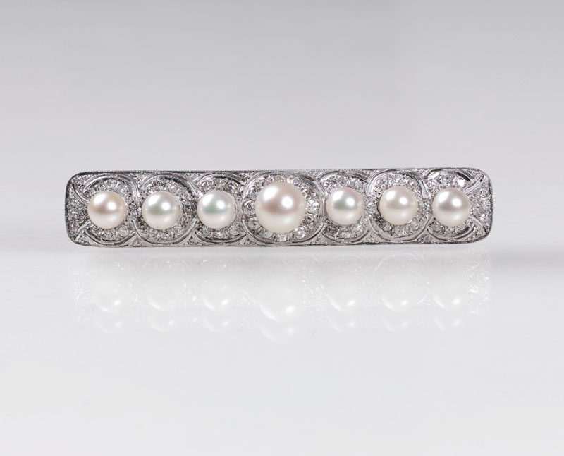 An Art Déco diamond brooch with natural pearls
