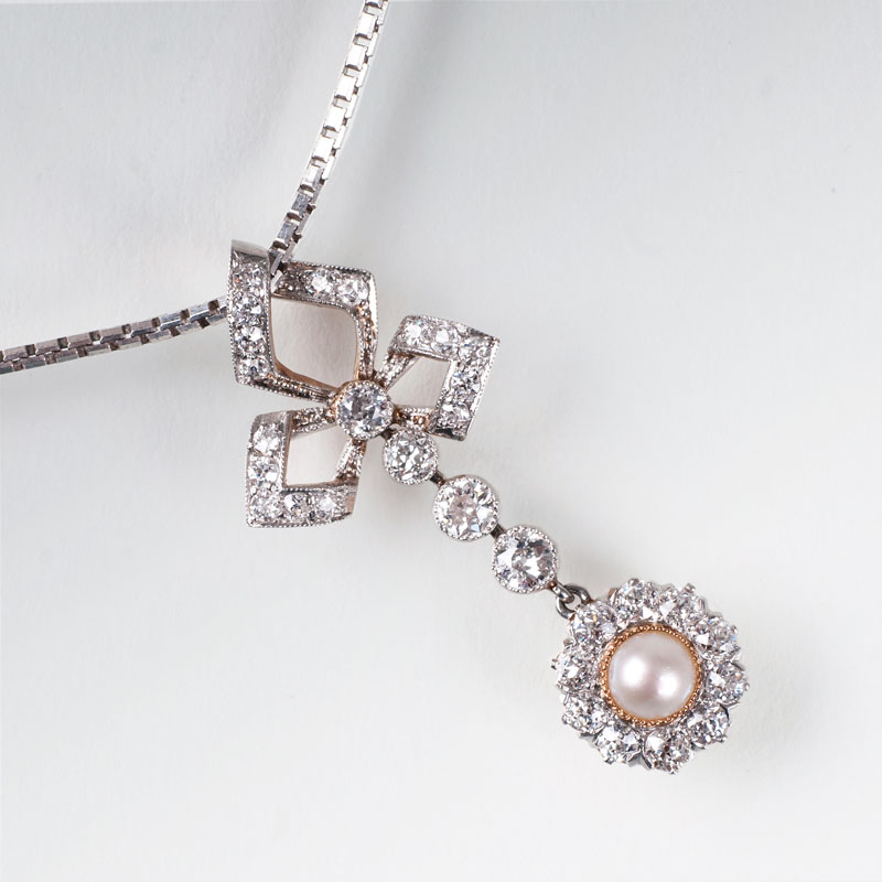 An old cut diamond pendant with mabé pearl