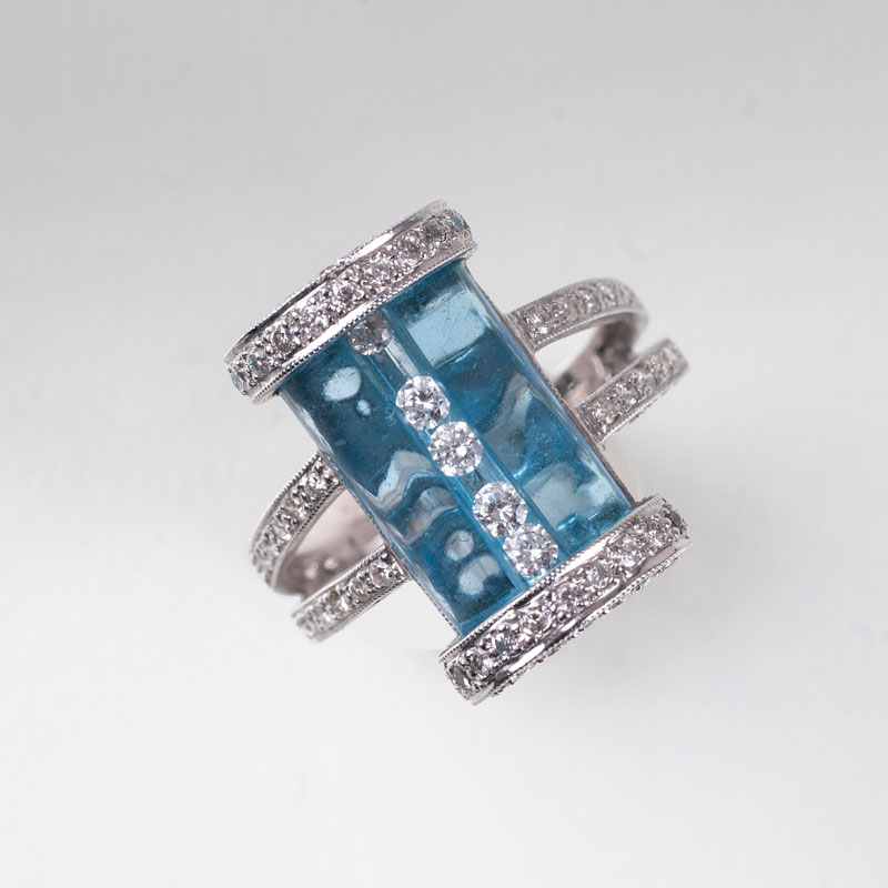 A modern blue topaz diamond ring
