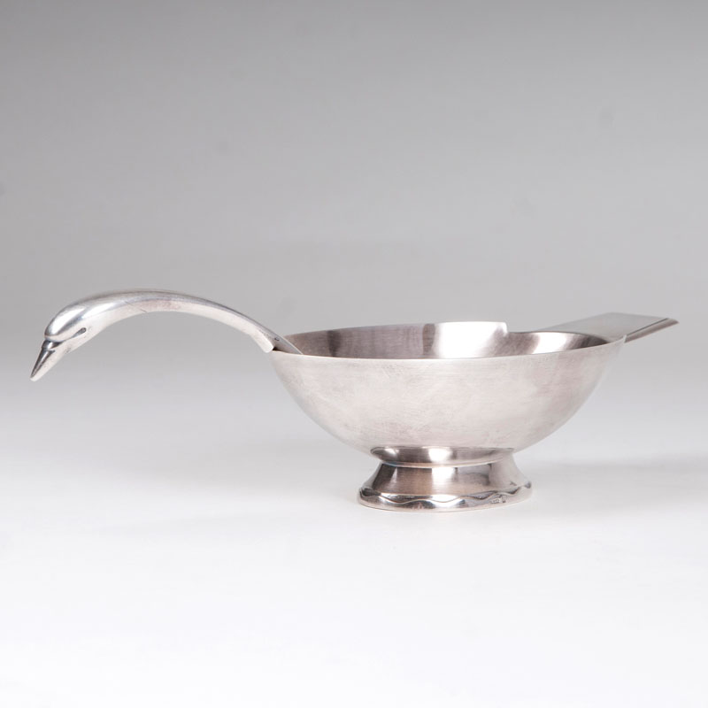 An Art Déco saucière and spoon with swan design by Christofle