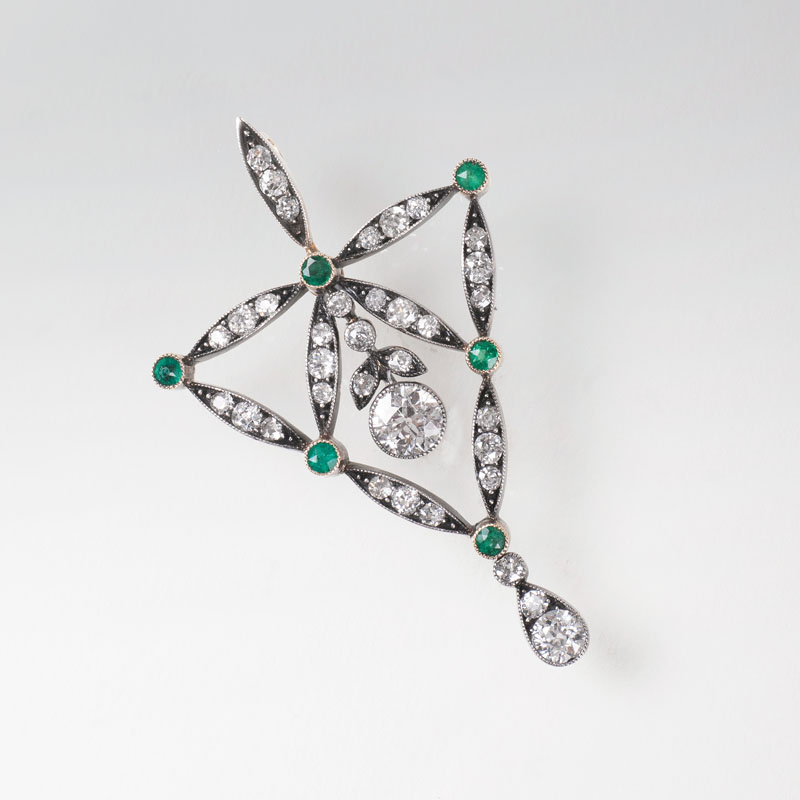 An Art Nouveau pendant with diamonds and emeralds