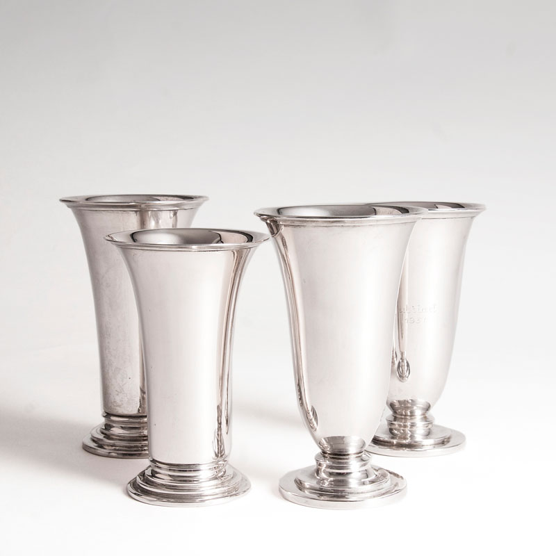 A set of 4 small vases