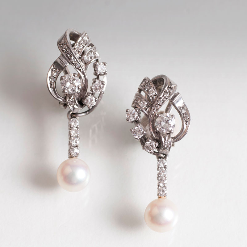 A pair of vintage diamond pearl earrings