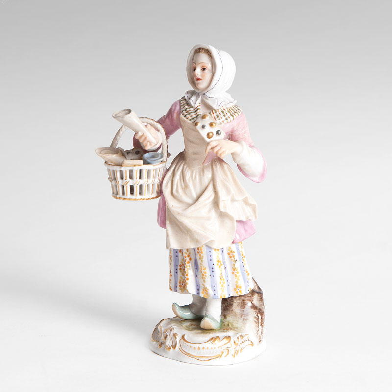 A porcelain figure 'Waffle Seller'