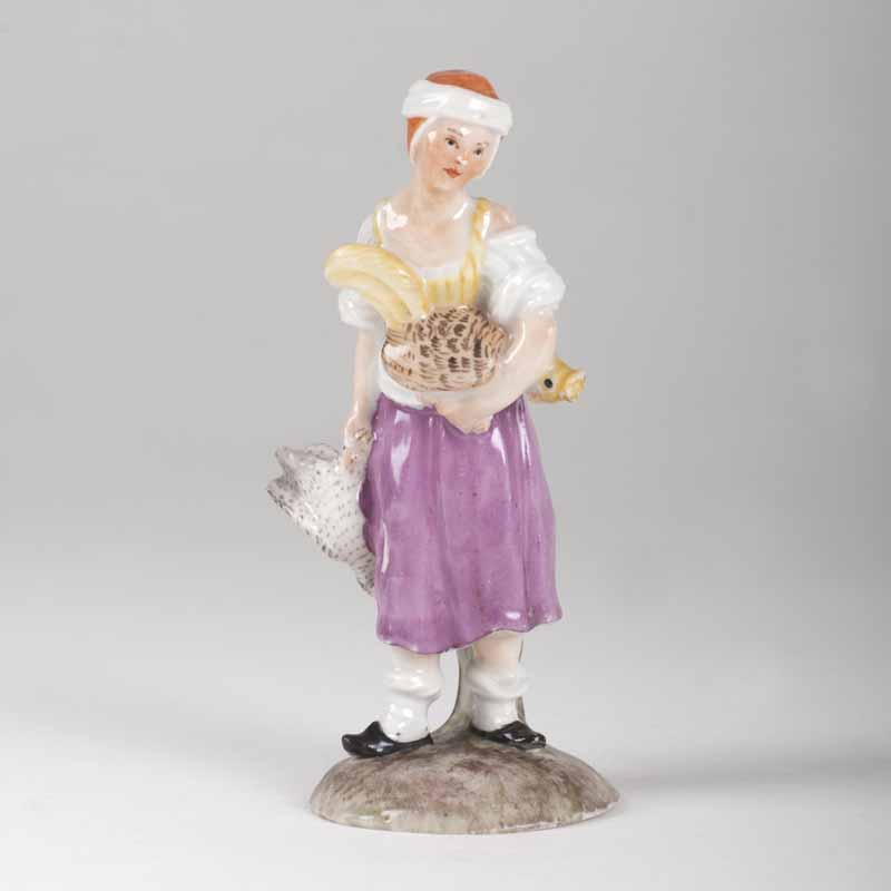 A porcelain figure 'countrywoman with a rooster'