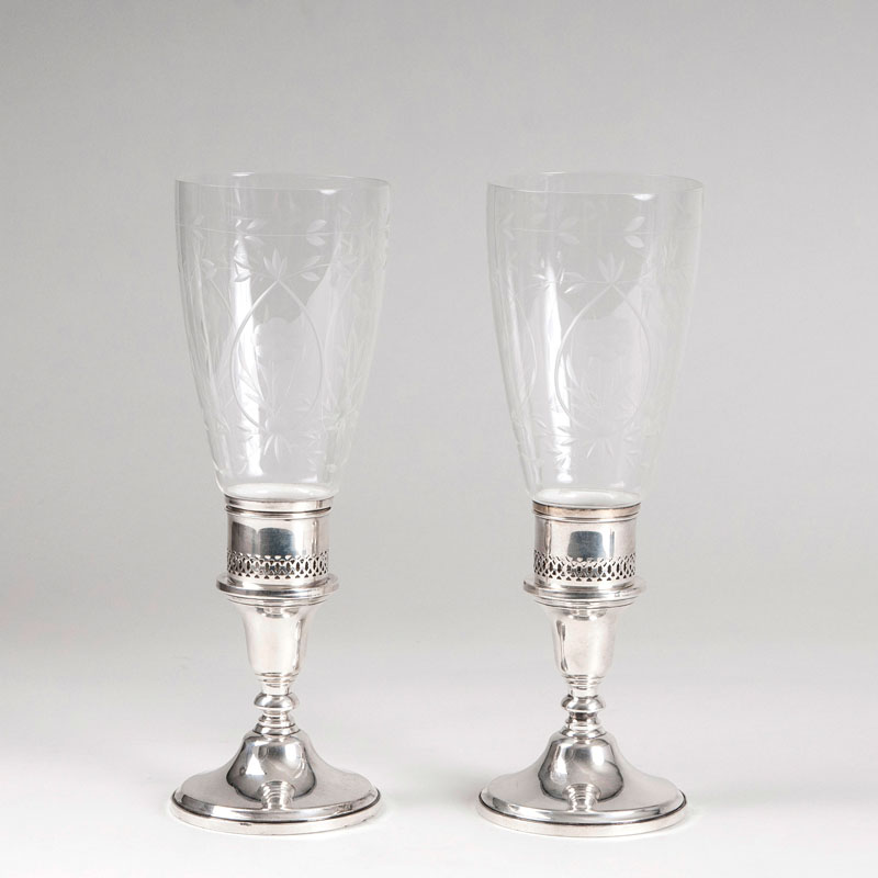 A pair of decorative candleholders