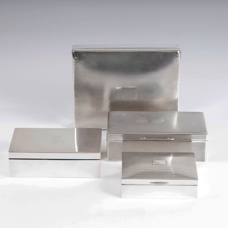 A set of 4 silver boxes