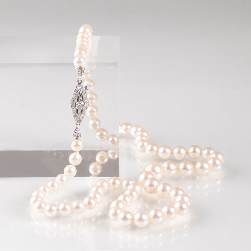 A pearl necklace with diamond clasp