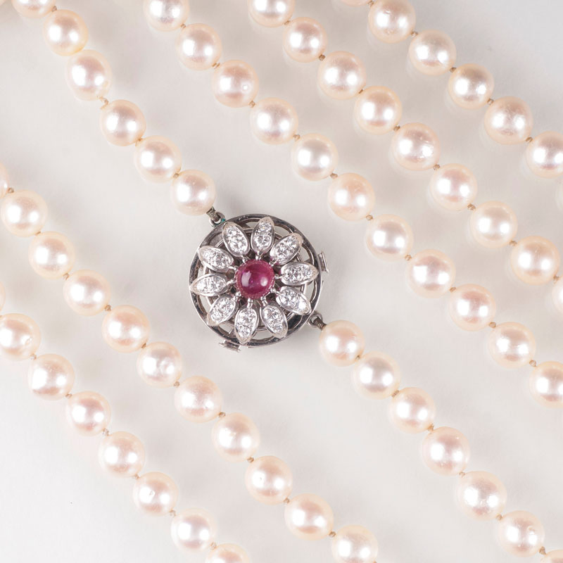 A pearl sautoir with a ruby diamond clasp
