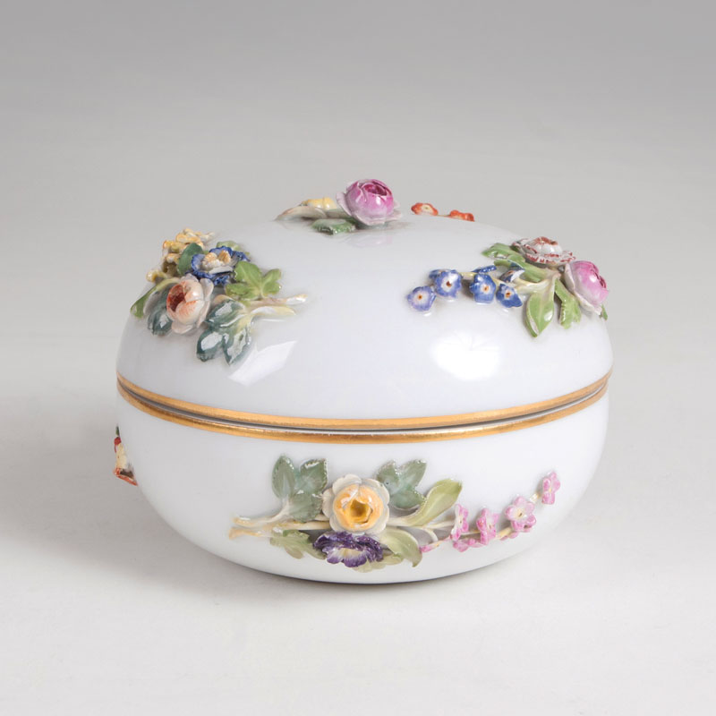 A lidded box with sculptural flowers