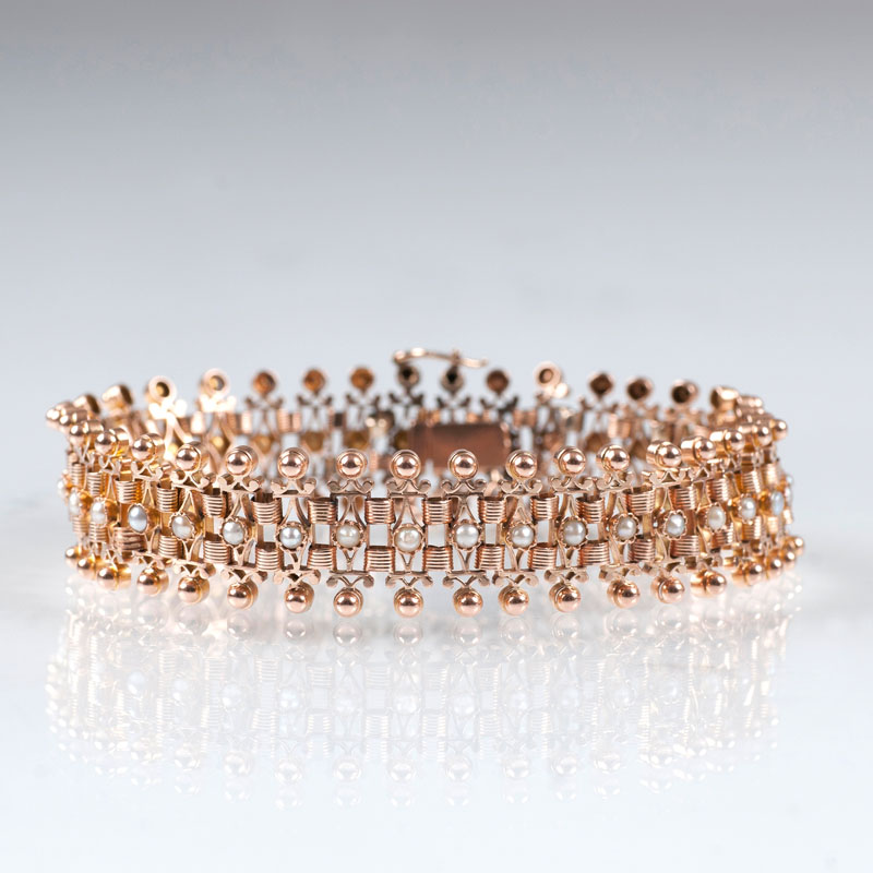An antique golden bracelet with seed pearls