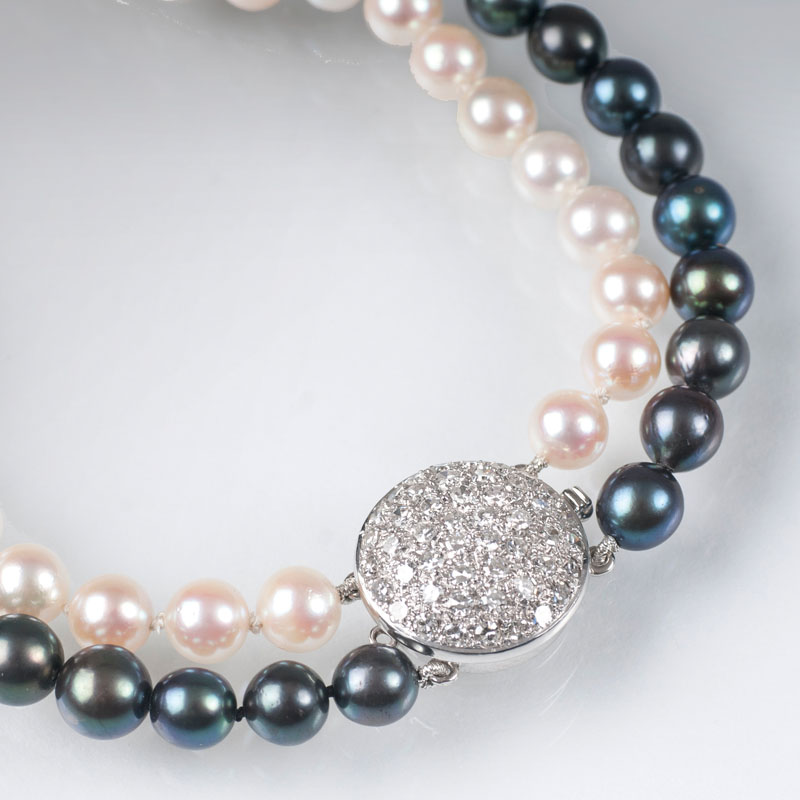 A pearl necklace with diamond clasp