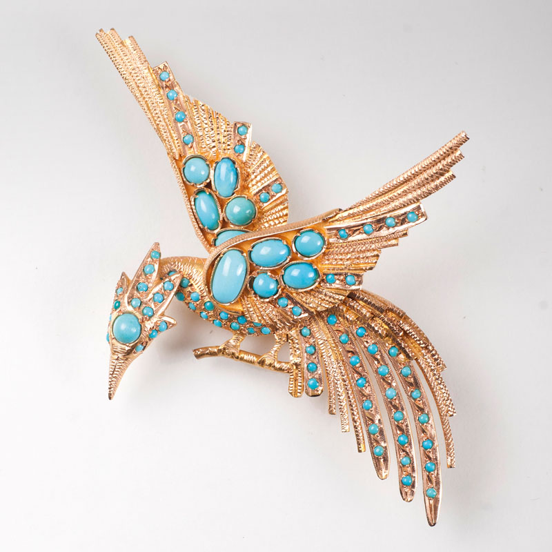 A Vintage golden brooch with turquoise 'Phoenix'