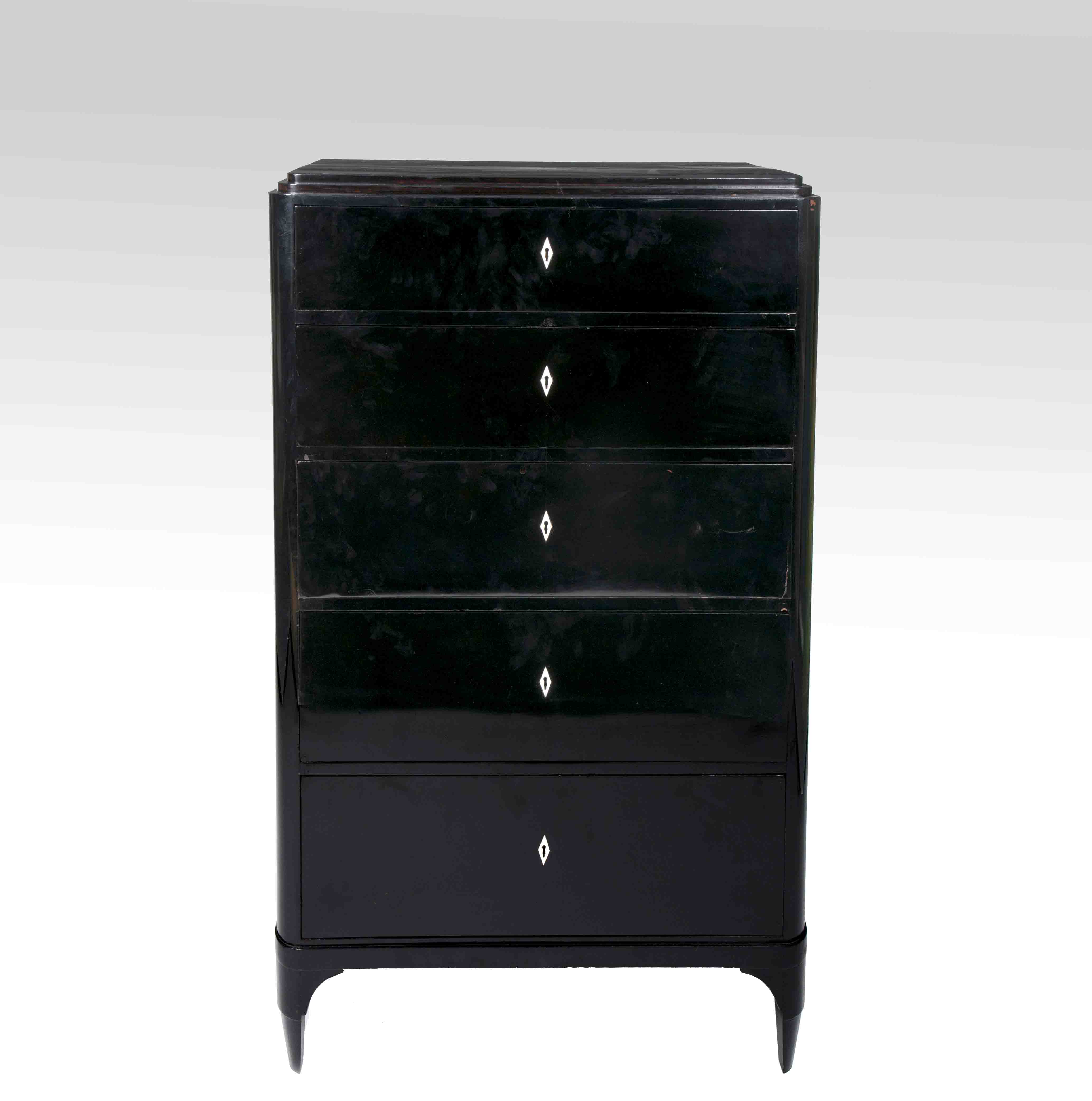 An ebonized chest of drawers