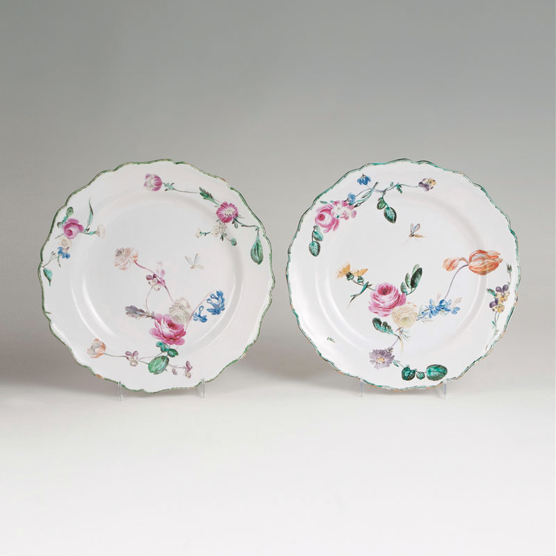 A pair of faience plates with fine flower painting