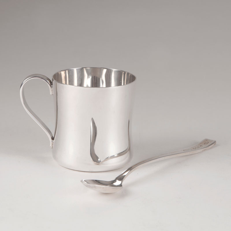 A modern baptism beaker with matching spoon