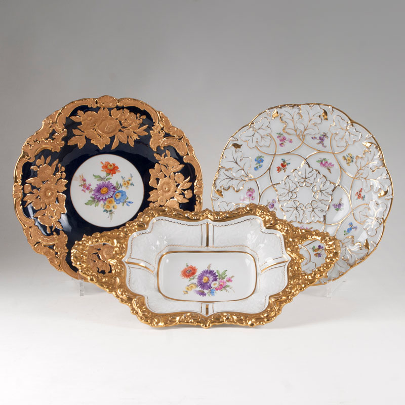 A set of 3 porcelain dishes with rich gold relief