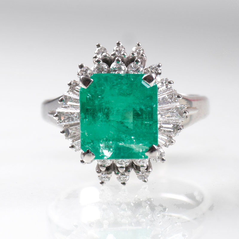 An emerald diamond ring