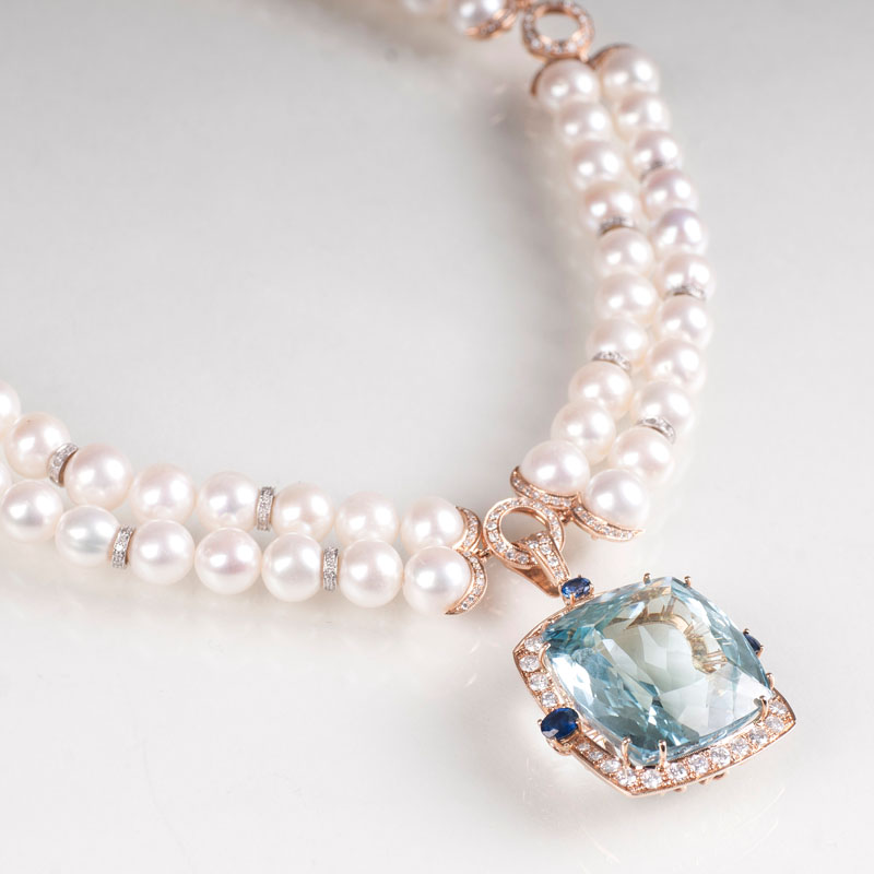 A pearl necklace with a fine aquamarine sapphire pendant