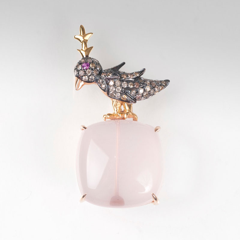 A rose quartz pendant with diamond-figure of a bird
