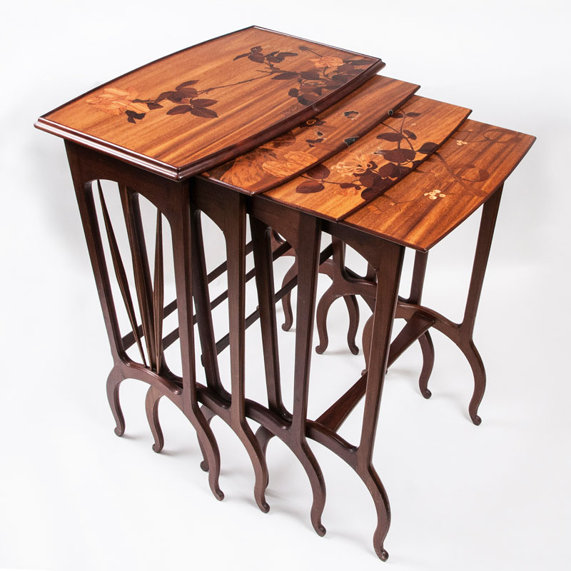 A set of 4 Art Nouveau side tables with floral intarsia