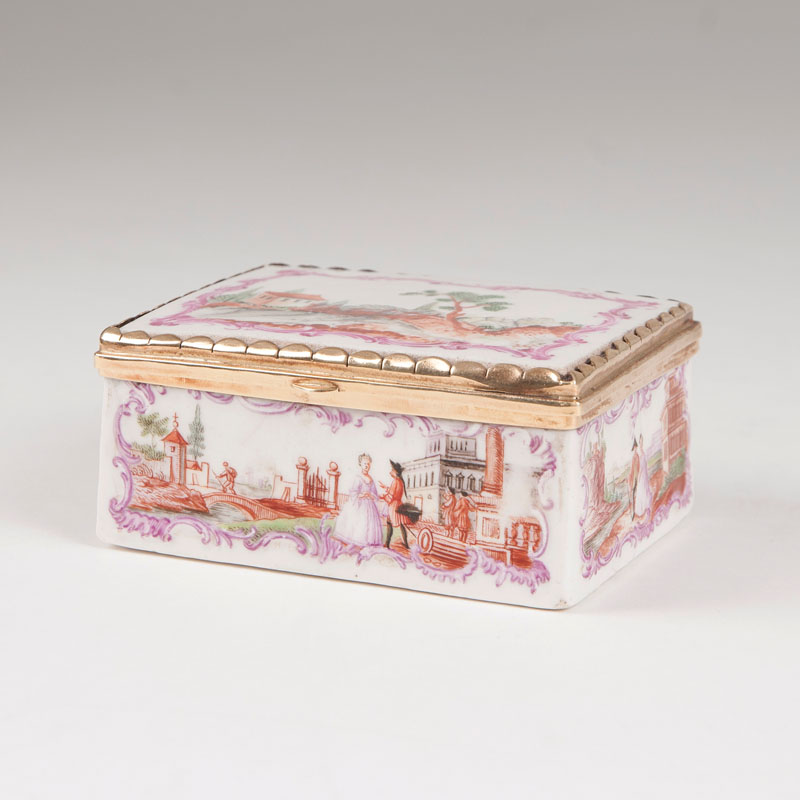 A porcelain tabatière with rocaille relief and landscape scenes
