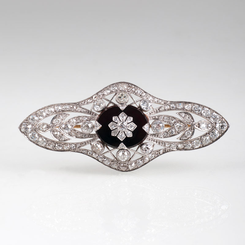 An Art Déco diamond onyx brooch