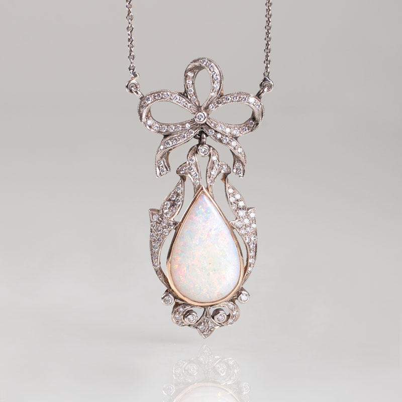 An opal diamond pendant with necklace in the style of Art Nouveau
