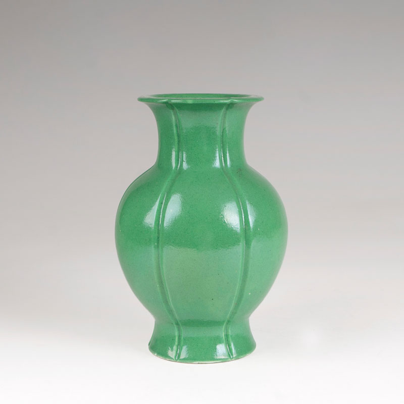 A porcelain baluster-shaped vase with apple-green glaze