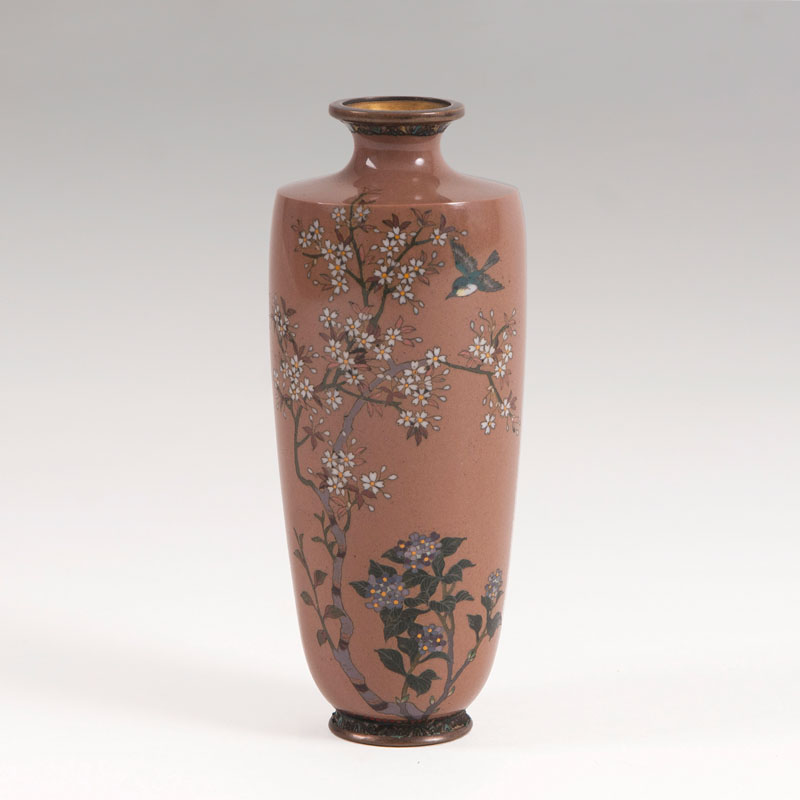 A Cloisonné rouleau vase with flower decor