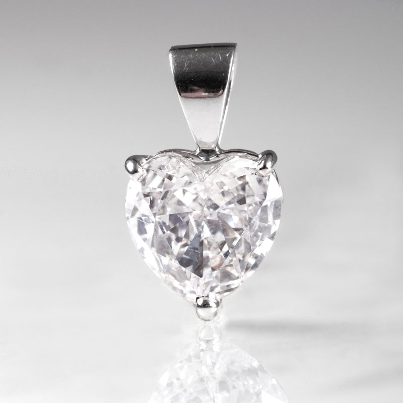 A pendant with a heart shaped diamond