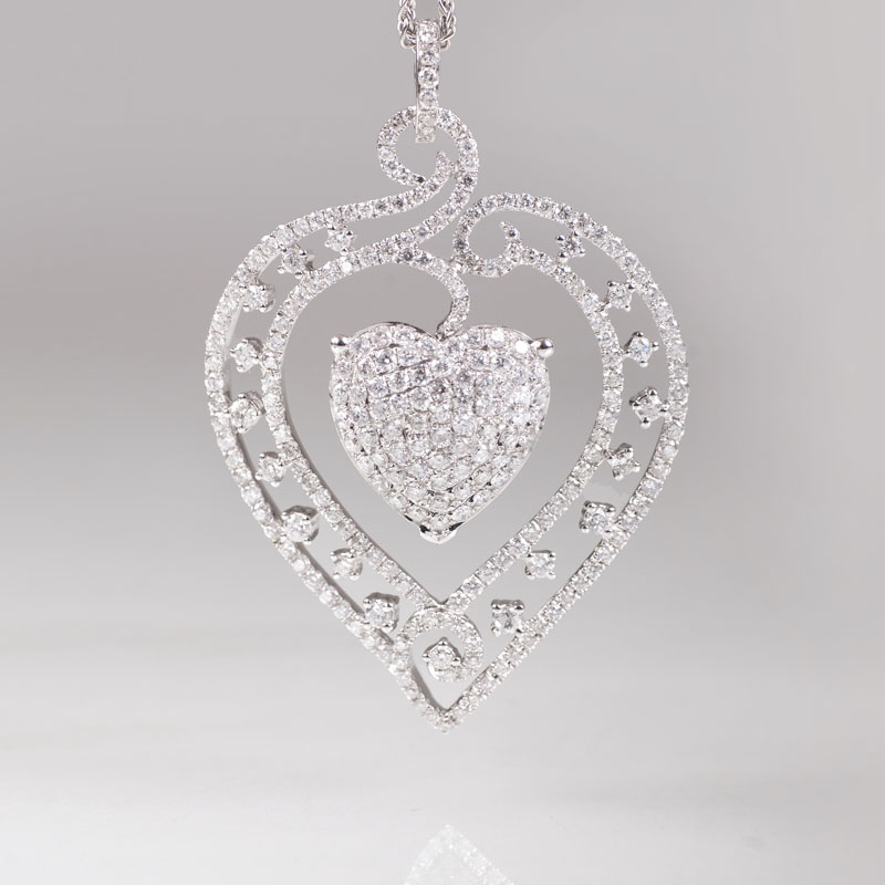 A heartshaped diamond pendant with necklace