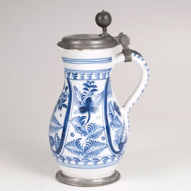 A small fayence pear-shaped jug with blue painting