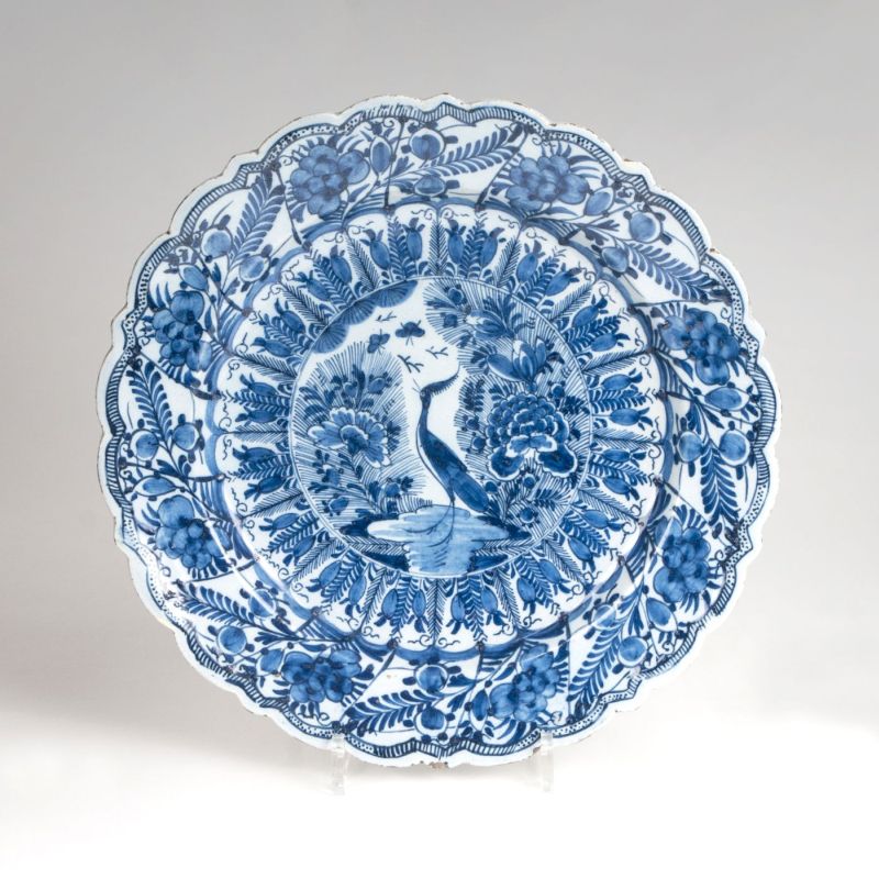 A faience plate with peacock decor