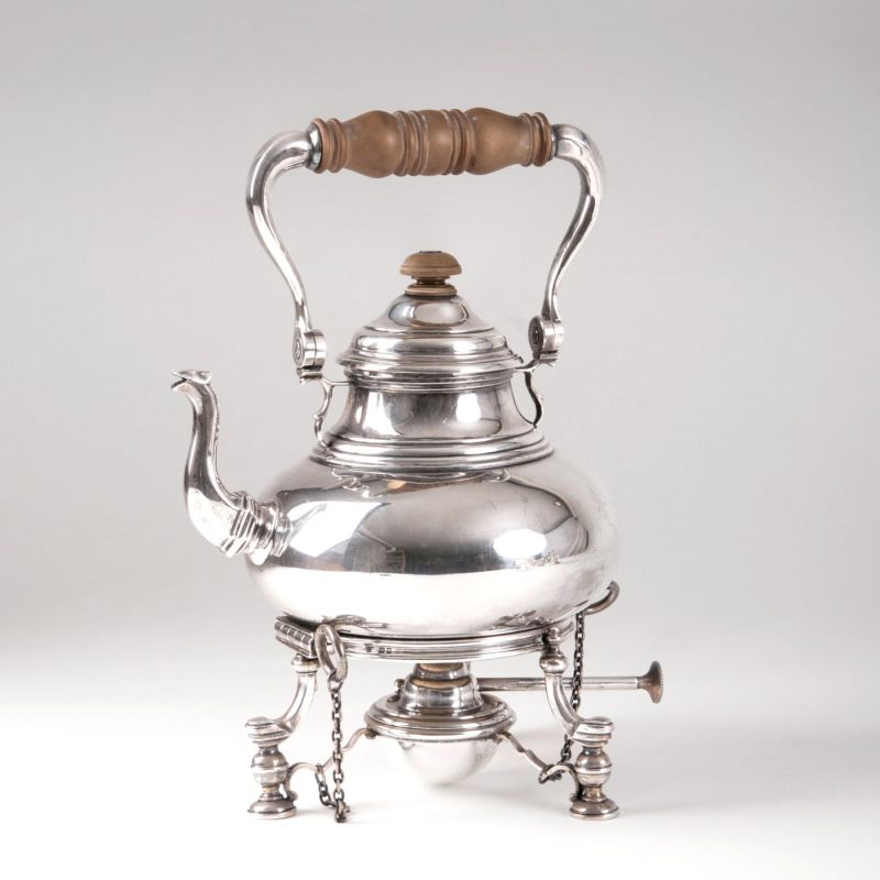 A teapot in georgian style with rechaud