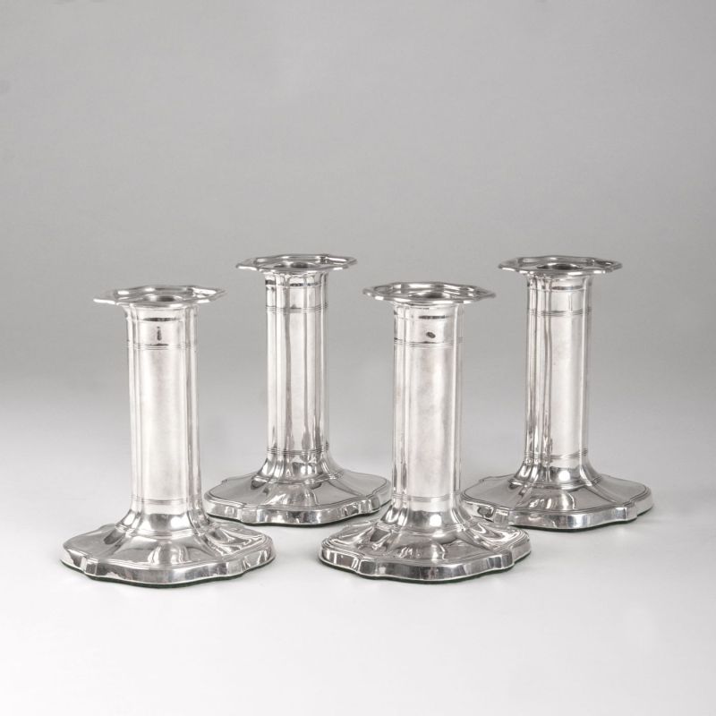 A set of 4 classical candleholders