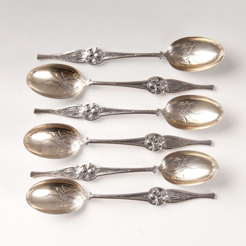 A set of 18 Art Nouveau mocca spoons with Iris decor