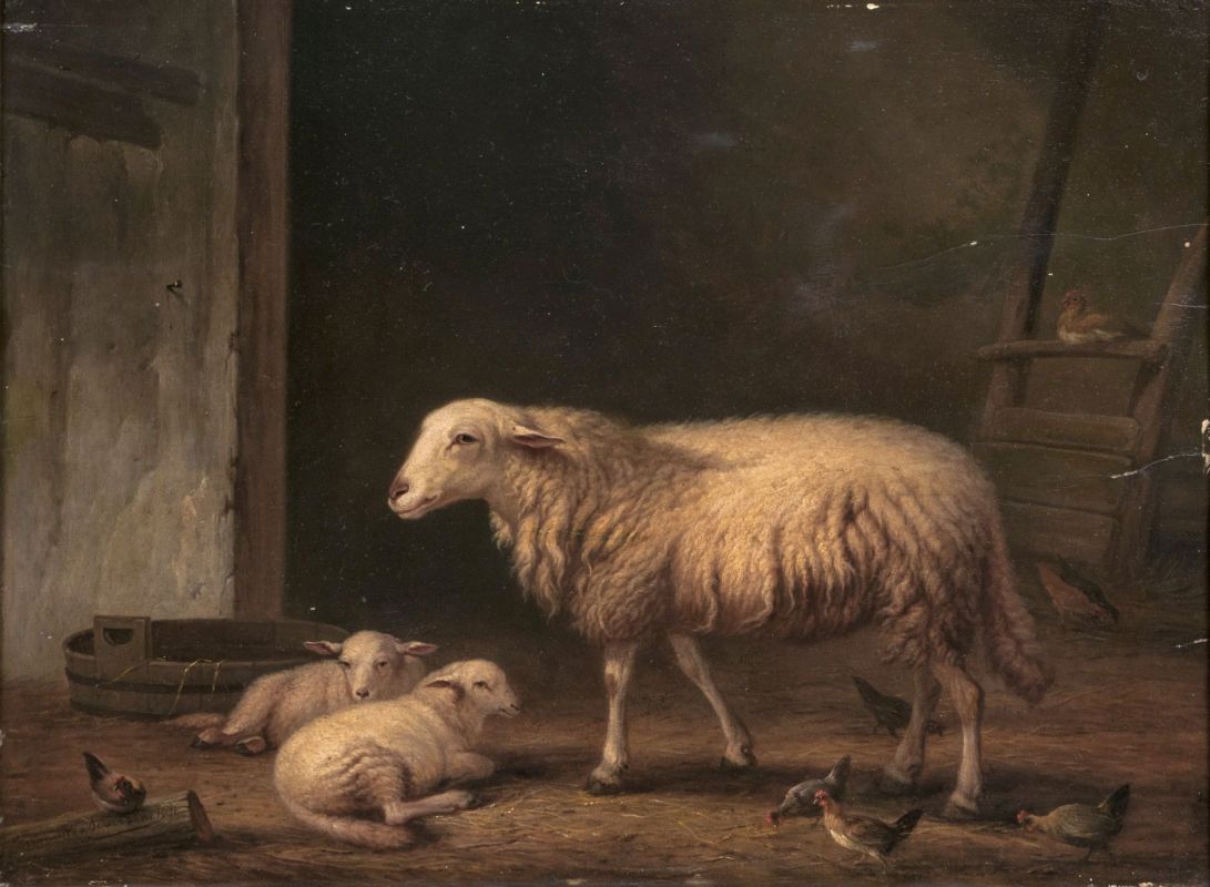 Schaf mit Lämmern im Stall