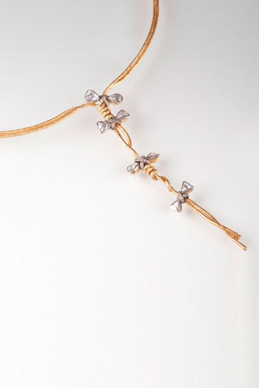 A gold necklace with diamonds