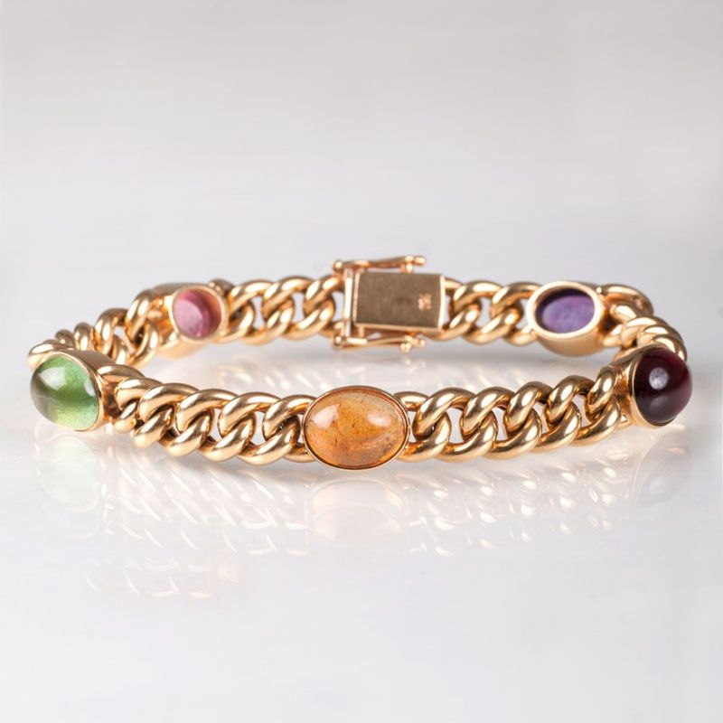 A curb chain bracelet with cabochons