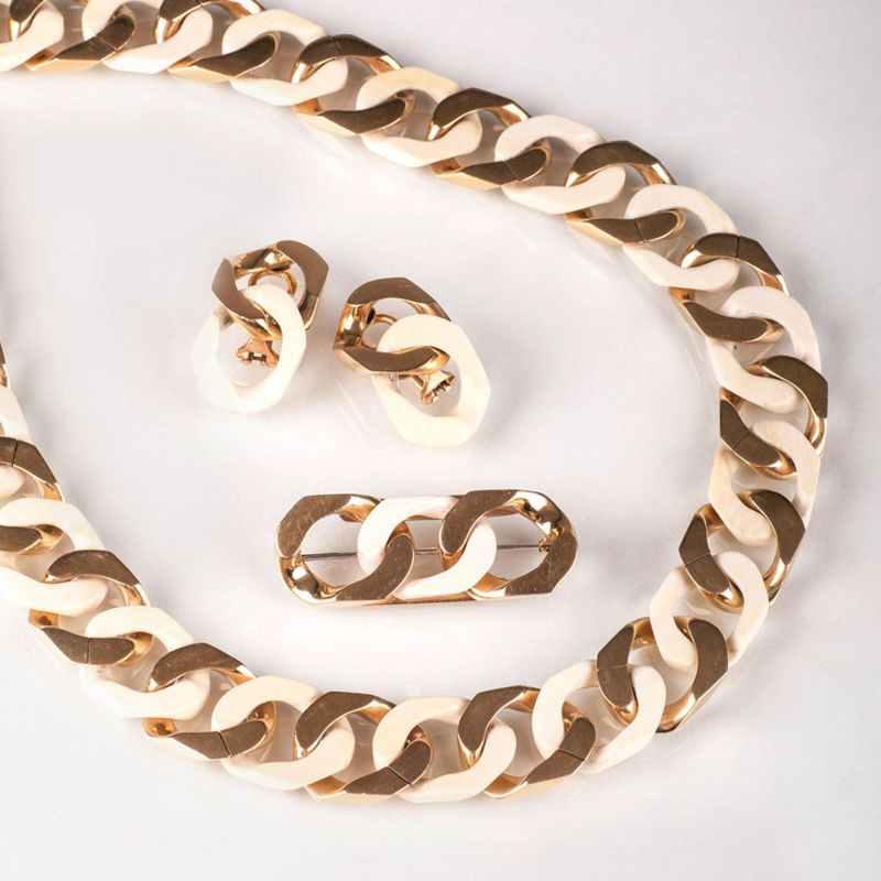 - A gold ivory necklace with matching earrings and brooch by Jeweller Wilm A gold ivory necklace with matching earrings and brooch by Jeweller Wilm