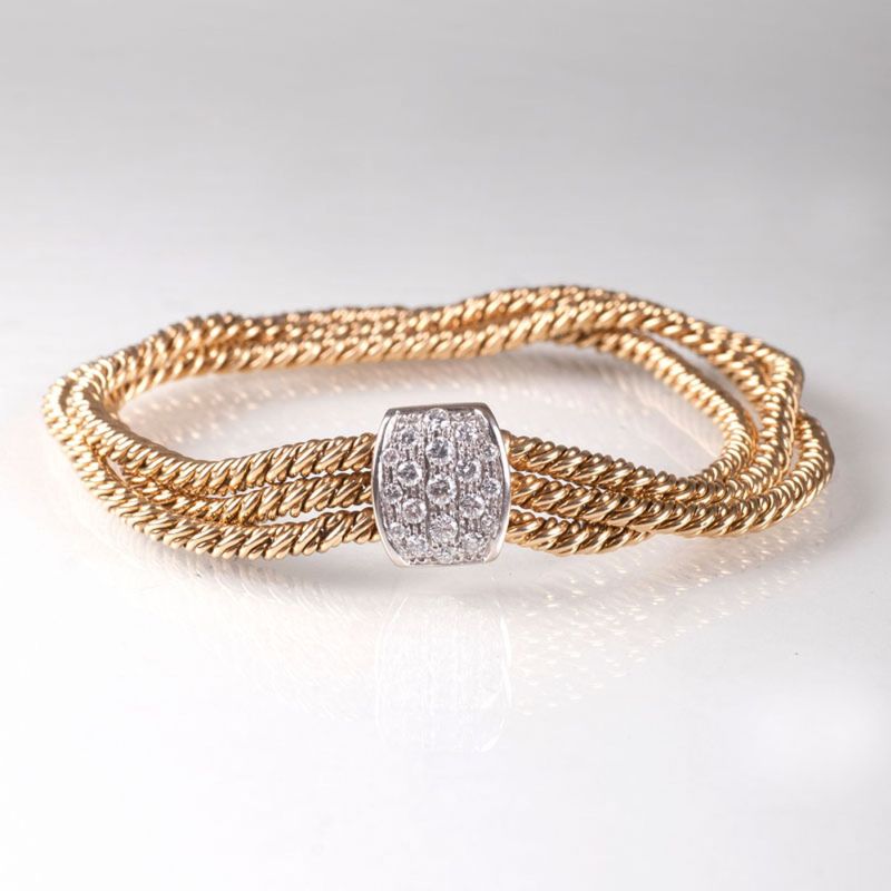 A gold bracelet with diamond clasp by Pomellato