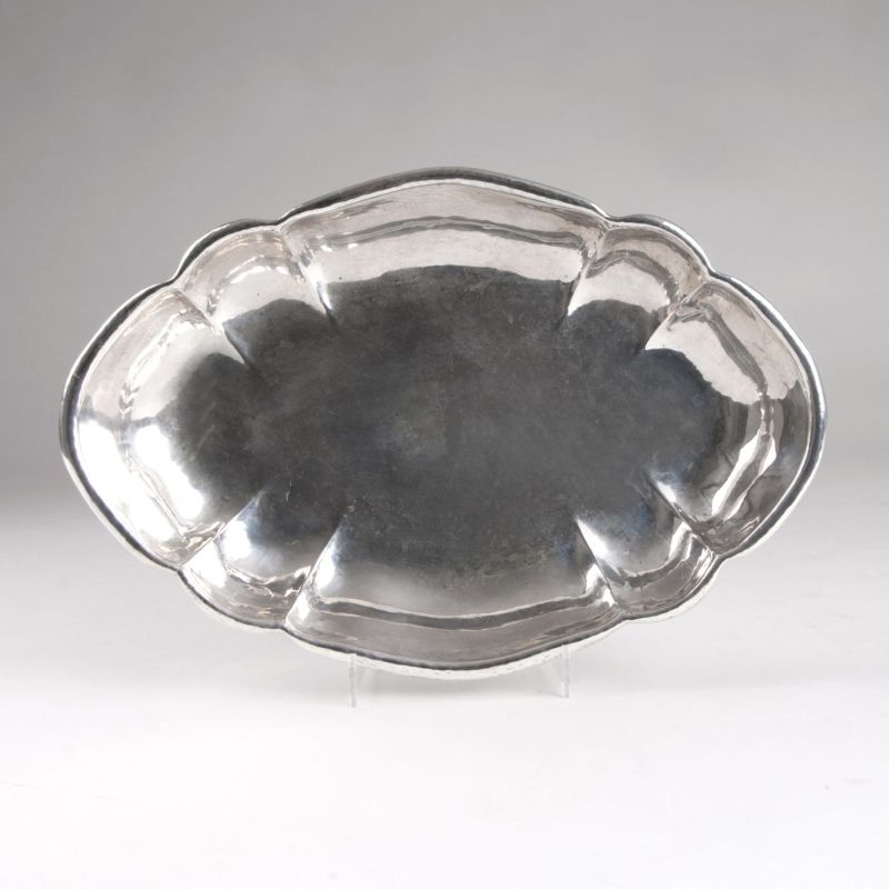 A serving plate with chippendale decor