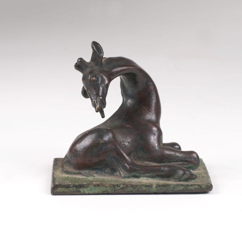 A small animal bronze 'Lying young Giraffe'