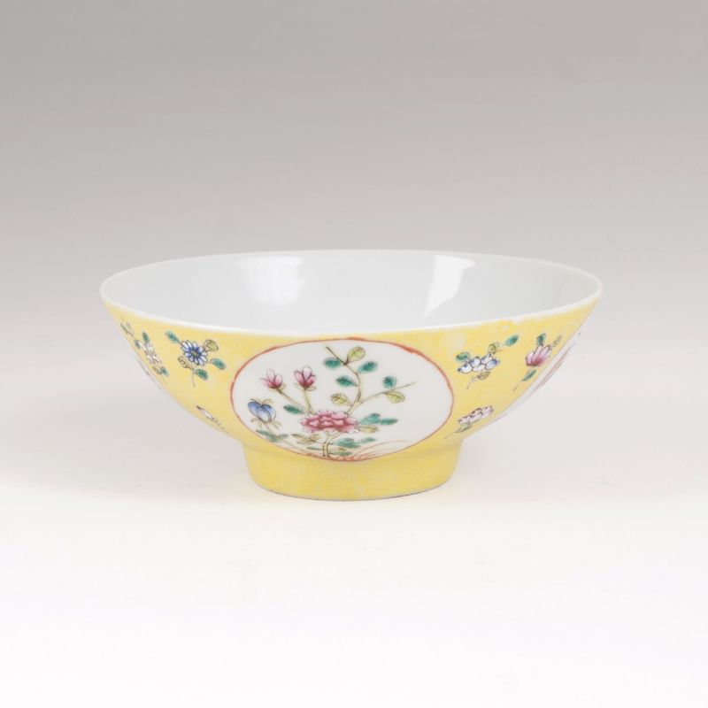 A porcelain bowl with lemon yellow ground and enamel painting