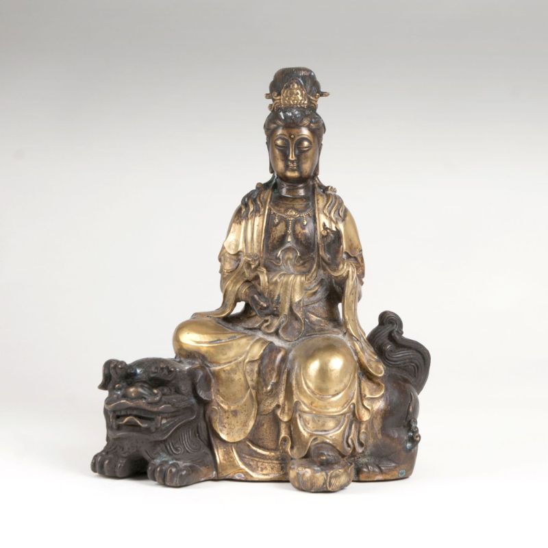 A bronze sculpture 'Guanyin sitting on a lion' A bronze sculpture 'Guanyin sitting on a lion'