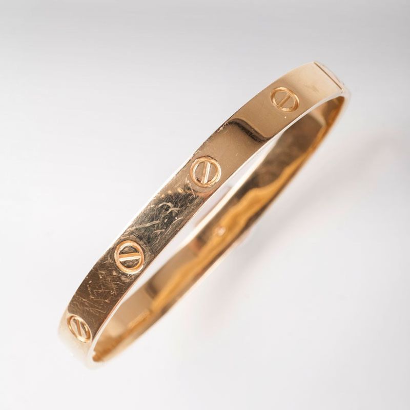 A golden bangle bracelet 'Love bracelet'