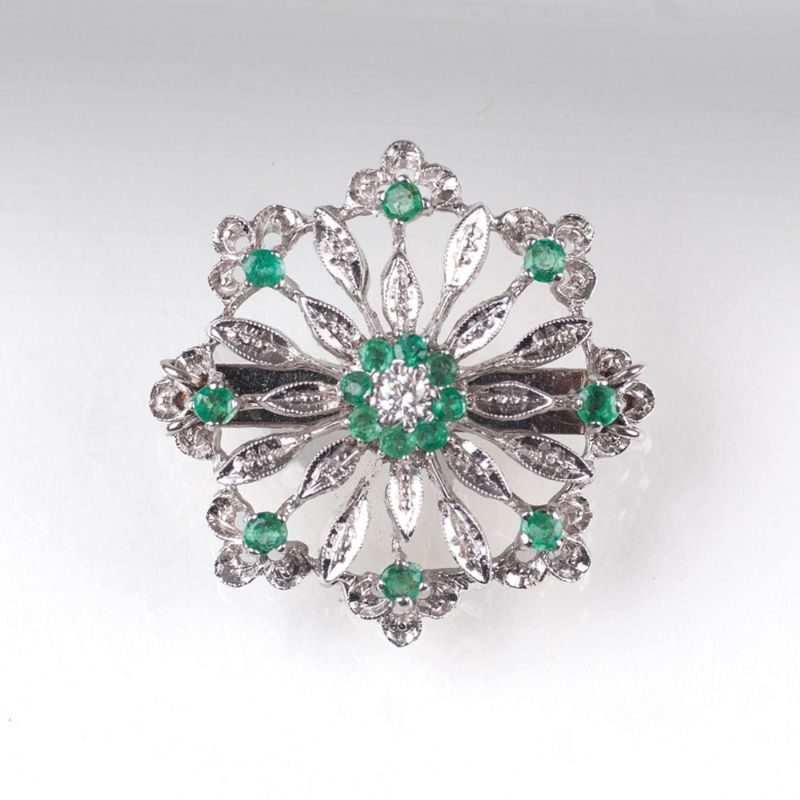 A petite emerald diamond brooch